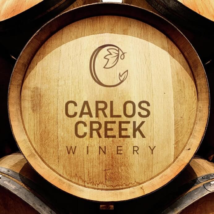 A wine barrel with the Carlos Creek Winery logo engraved.