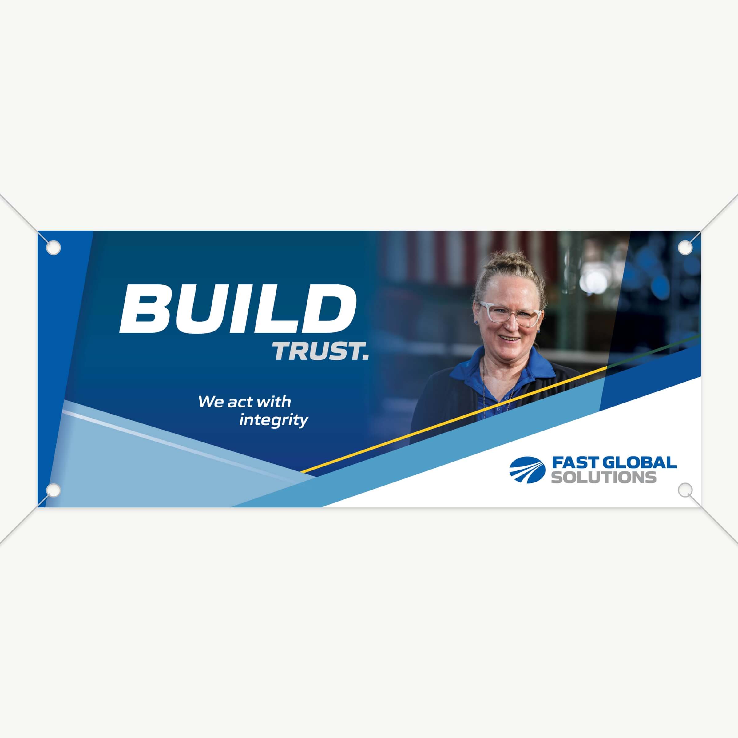 A horizontal banner featuring an employee image and one of the company values.