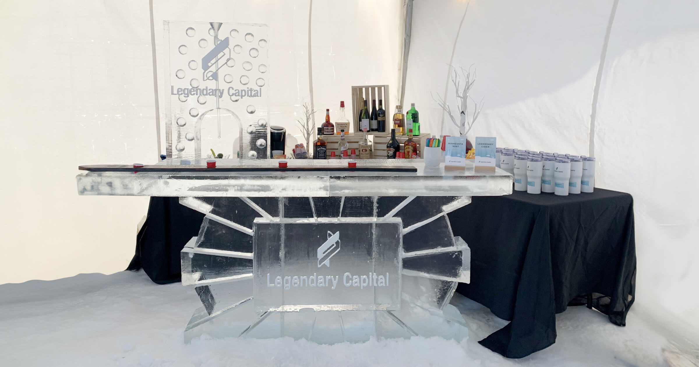 An ice sculpture bar with the company logo engraved.