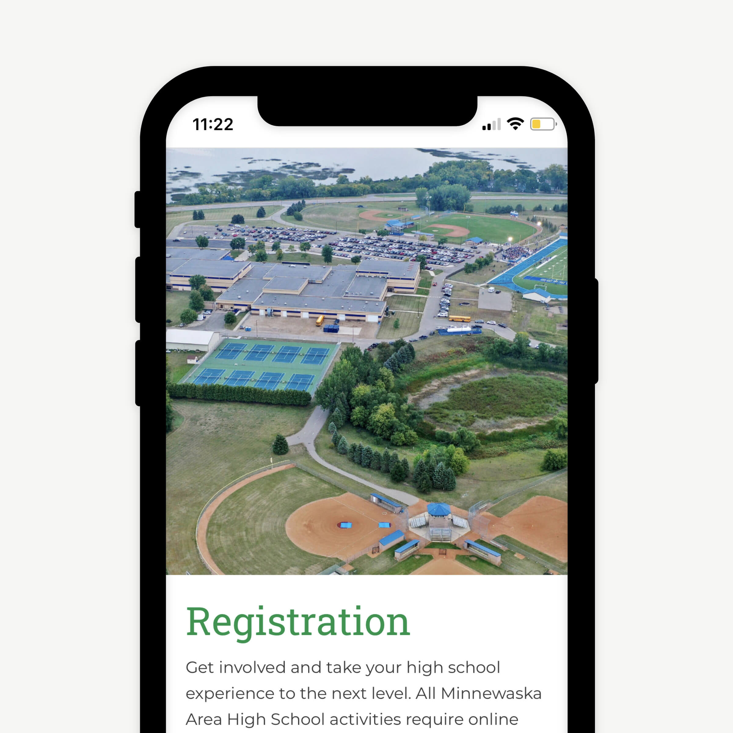 A mobile website design showcasing a high school sports field photo and information on how to register.