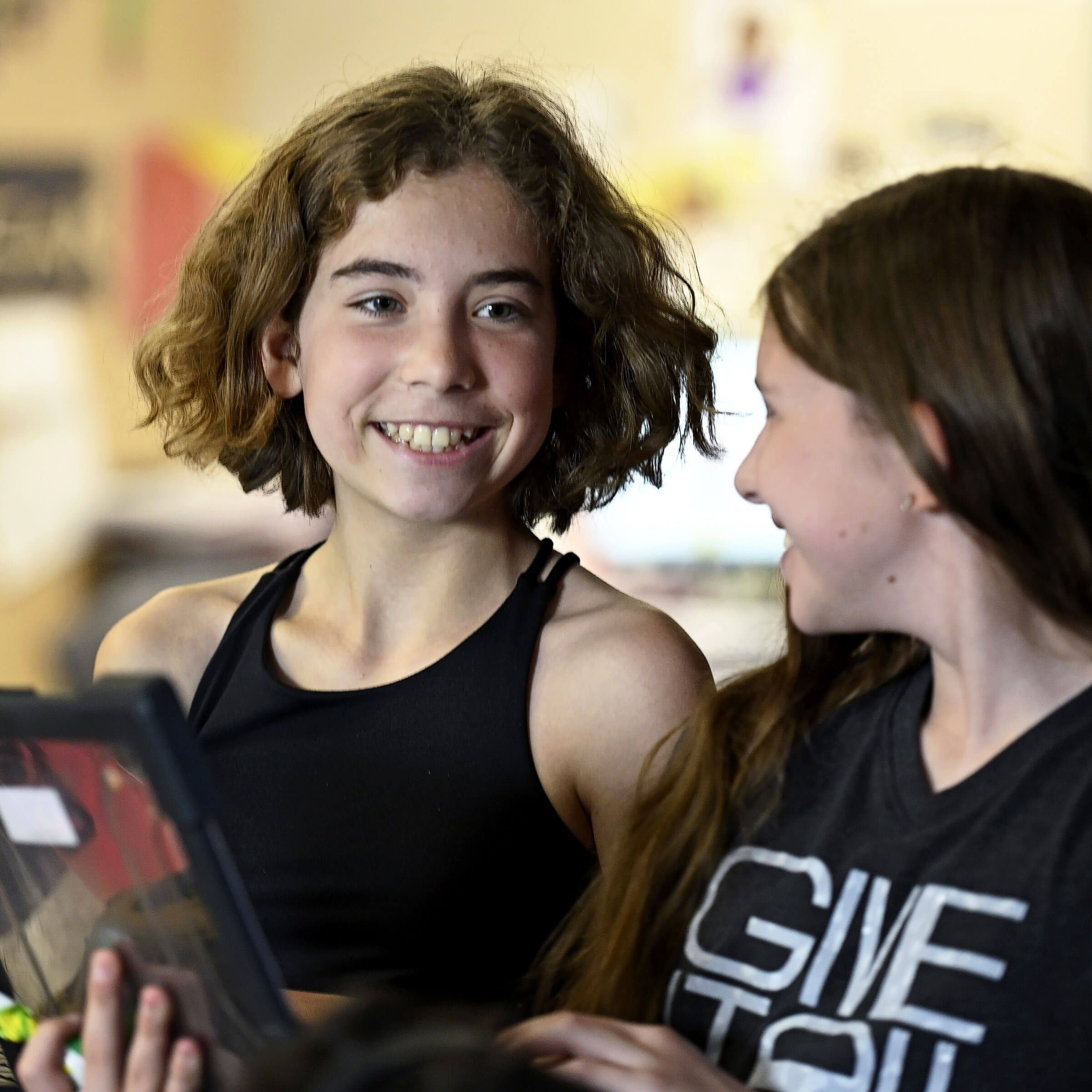 Two students using a laptop.